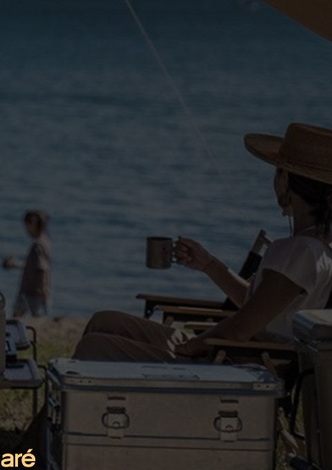 Friends enjoying coffee outdoors by the sea